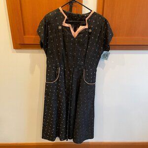 Long black dress with pink trim, belted